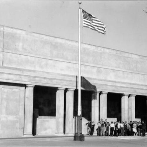 [Group of students standing outside the auditorium of Portola Junior High School]