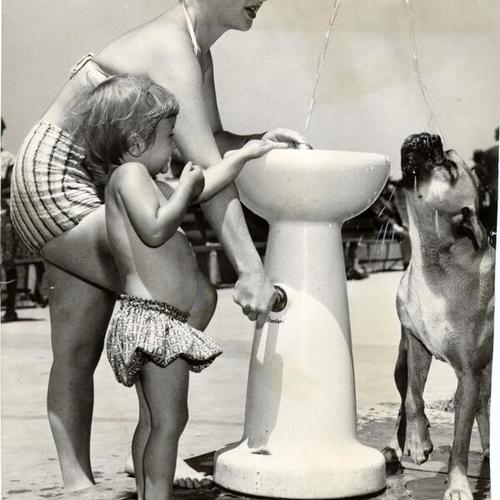 [Charlene Amans and her daughter Heather with their dog at Ocean Beach]