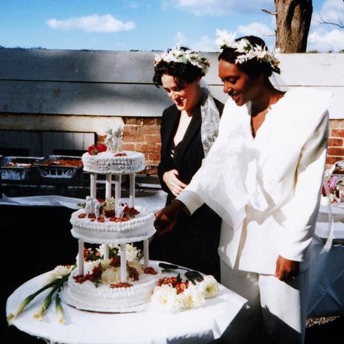 [Shannon and Jenna cutting their wedding cake at Fort Mason in 1995]