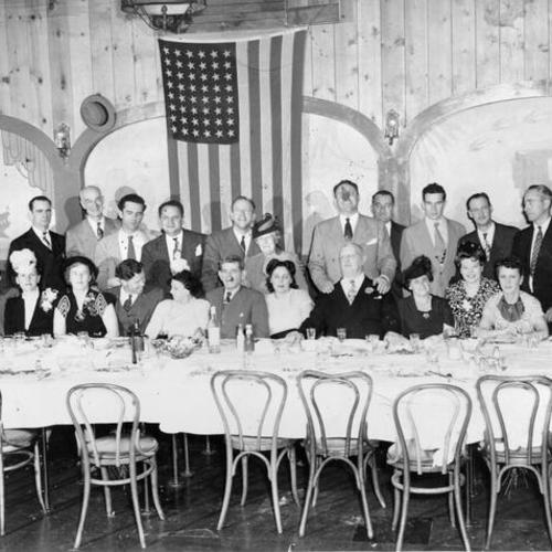 [Unidentified group posing for picture at the New Tivoli restaurant]