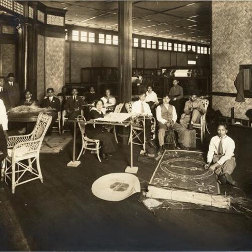 [Craftspeople inside the Philippine Pavilion at the Panama-Pacific International Exposition]