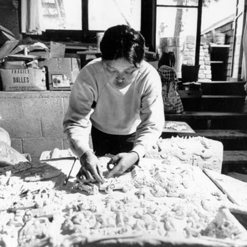 [Ruth Asawa working on cast bronze fountain for the Grand Hyatt Hotel on Union Square]