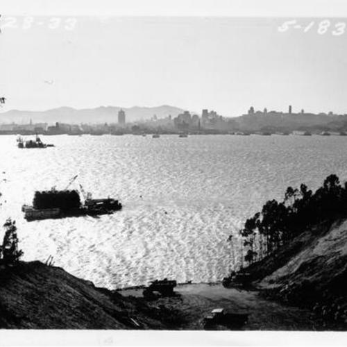 [Landscape view of San Francisco in the background from Yerba Buena Island, showing west approach cut to the tunnel ready for the deck of San Francisco-Oakland Bay Bridge]