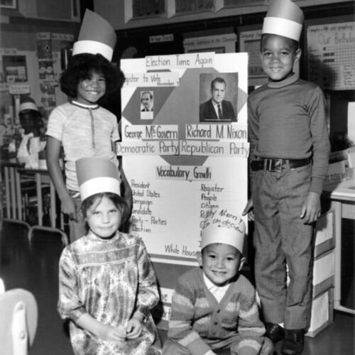 [Four students at Commodore Sloat Elementary School posing with a project relating to the presidential election of 1972]