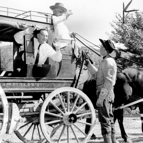 [Edmund G. (Pat) Brown, Democratic candidate for governor, faces a "bandit" at the start of his day-long stagecoach campaign trip through the Mother Lode country]