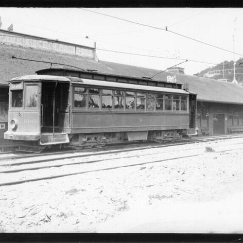 [Number 20 line streetcar in front of old steam railroad depot at La Playa and Balboa streets]