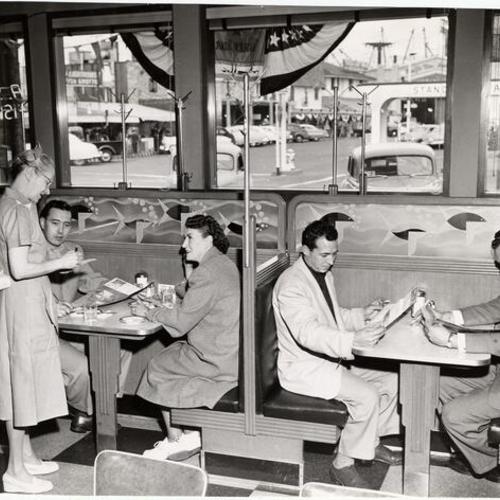 [Customers seated inside A. Sabella's restaurant]