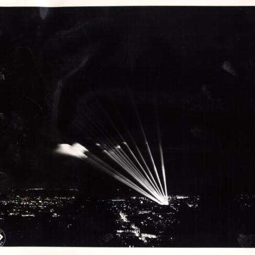 [View of U. S. Army anti-aircraft searchlights shining from Seals Stadium]