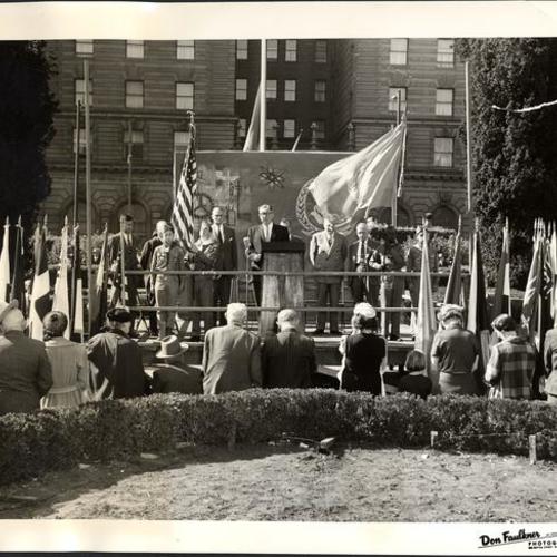 [U.N. Day ceremony in Union Square with Judge Orla St. Clair (at microphone) opening noon-time program]