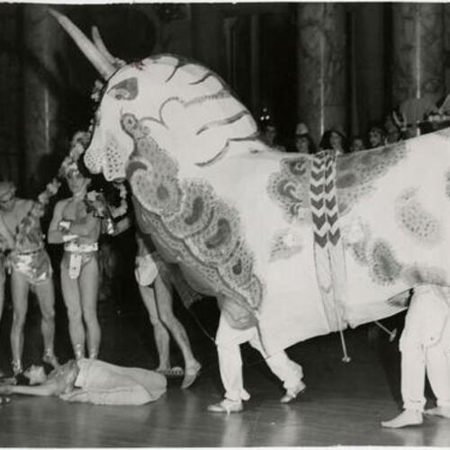 People in costume with minotaur at the Palace Hotel for the Parilia Amusement Ball