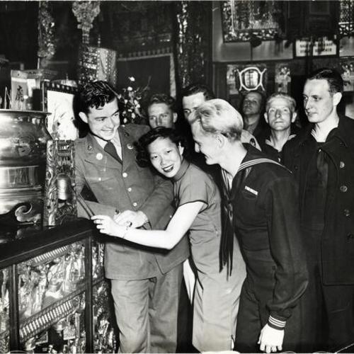 [Chinese woman entertaining service men at the YWCA in Chinatown]