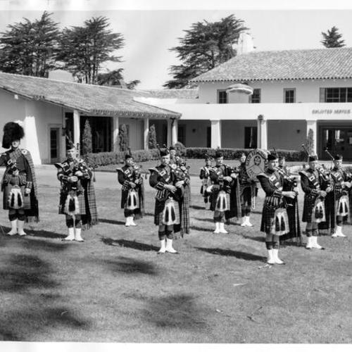 [Sixth Army Pipe Band playing in front of the Enlisted Service Club, Presidio of San Francisco]