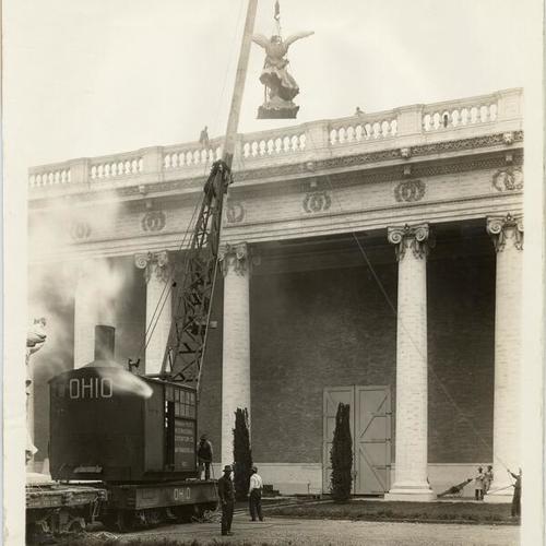 [Placing "Acroteria" on gable of the Palaces of Agriculture, Panama-Pacific International Exposition]