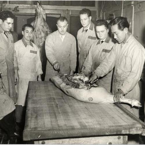 [Students learning meat cutting skills at San Francisco Junior College]