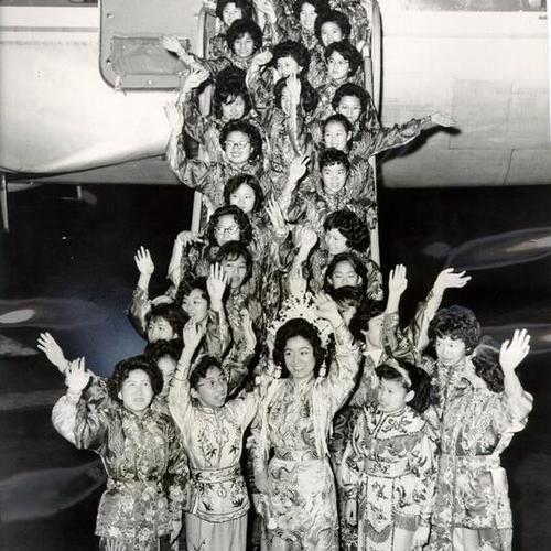 [St. Mary's Chinese Girls Drum Corps posing for a picture before boarding a plane bound for Washington D. C.]