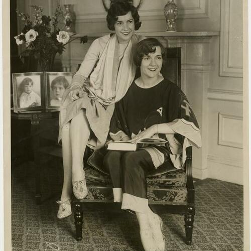 Natalie (left) and Constance Talmadge sitting on chair at Ambassador Hotel