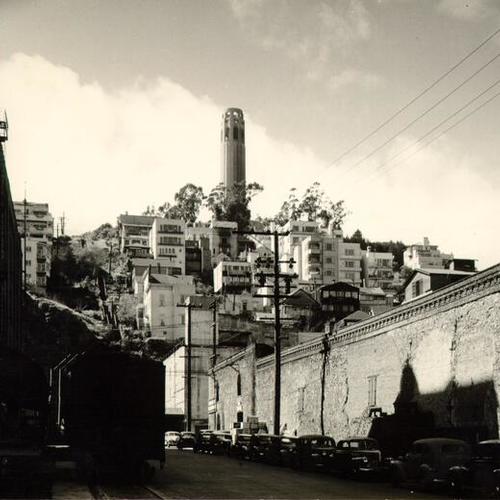[Griffing's Warehouse on Filbert Street, Telegraph Hill in background]