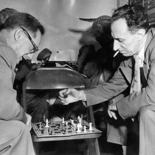 [Harry Bridges plays chess with a friend as the jury deliberates his fate in his perjury trial]
