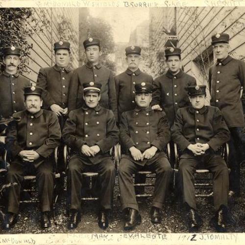 [Group photo of firemen at old Engine 23]