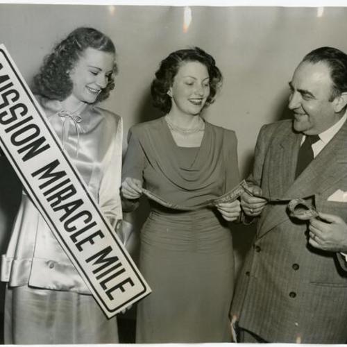 [June English, Barbara McCuen and Joseph S. Ravinsky during preparation for the Mission Miracle Mile "Dollar Day" event]
