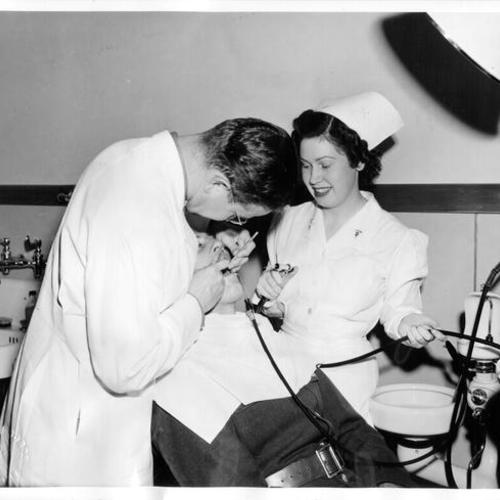 [Private Alvin J. Hopkins receiving treatment in the dental laboratory at Letterman General Hospital]