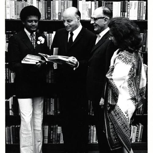 [Mayor Joseph Alioto and others reading at the Bayview/Anna E. Waden Branch Library]