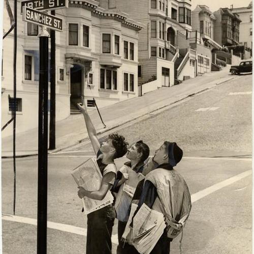 [Four newspaper lads, looking at a Gold Star marker erected at Eighteenth and Sanchez streets in honor of Sergeant Donald B. Gray, U.S.M.C. killed in actionj on Guadalcanal]