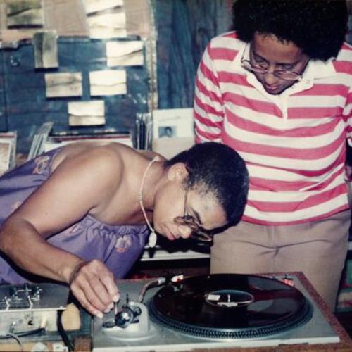 [Linda is the DJ at her birthday party in 1985]