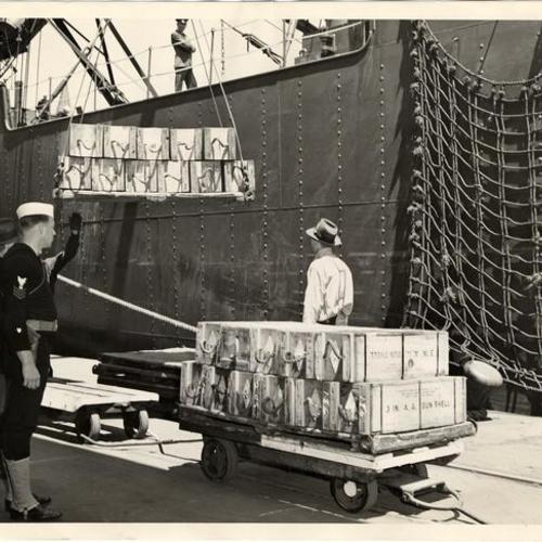 [Ammunition being loaded on a ship at the San Francisco waterfront]