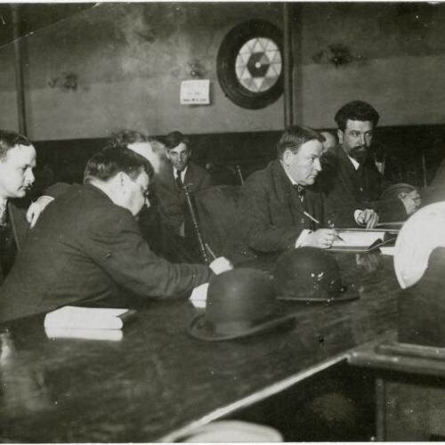 [Eugene E. Schmitz (far right) in court during bribery trial]