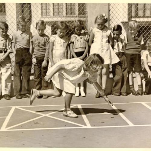 [Students playing hopscotch at Francis Scott Key School]