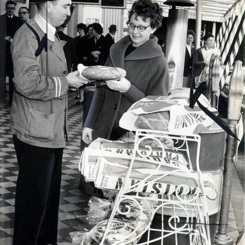 [Marian Tomm purchasing a loaf of bread at Fisherman's Wharf]