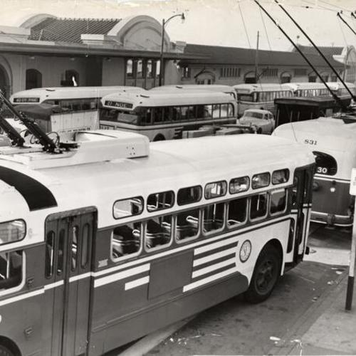 [Muni buses parked on Townsend Street, near Southern Pacific Depot]