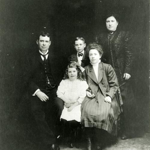 [Portrait of Joseph's family posing for a studio photo]