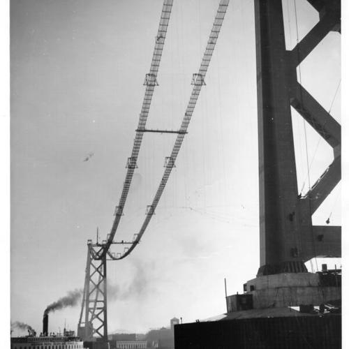 [View from San Francisco of the ferry, Southern Pacific Golden Gate Ferries, passing under San Francisco-Oakland Bay Bridge during construction]