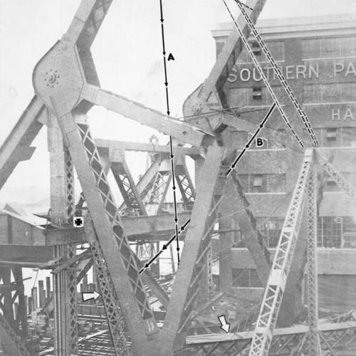 [View of Third street bridge span under construction with arrows pointing to crashing girder and it's original position]