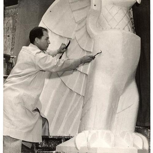 [Sculptor Jacques Schnier working on a plaster eagle, statue will be located in the Court of Flowers, Golden Gate International Exposition on Treasure Island]