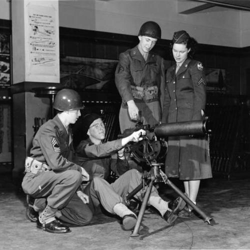 [Members of the Mission High School R. O. T. C. demonstrating a machine gun]
