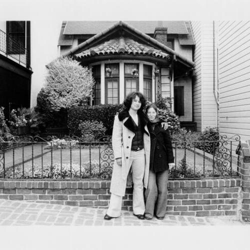 [Rosemary and Brandon Robles standing in front of a house on Stanyan near Hayes street]