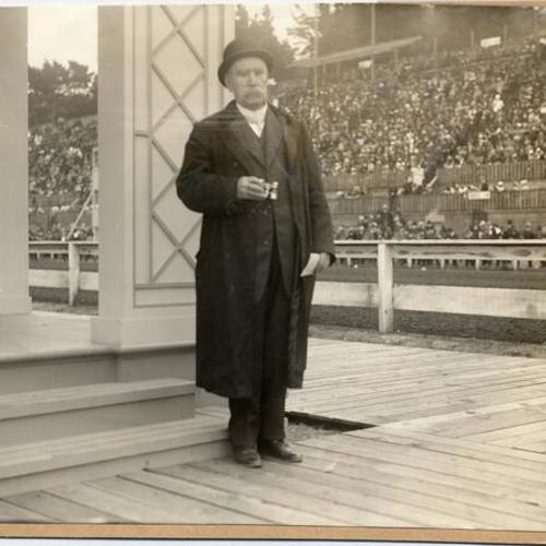[Spectator with binoculars at horse race at the Panama-Pacific International Exposition]