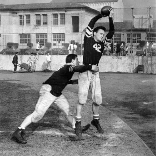 [Al Belcher tackling Wes Russell on the football field of Balboa High School]