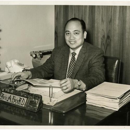 [Dr. Borja sitting at his desk in his medical office on Mission Street]