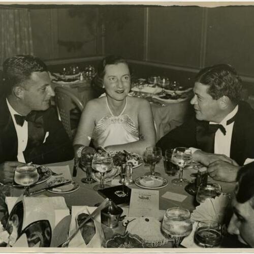 Henry Delafield Phelps (left), Mrs. S. F. B. Morse, and Edward S. Hilliam, Jr. sitting at dinner
