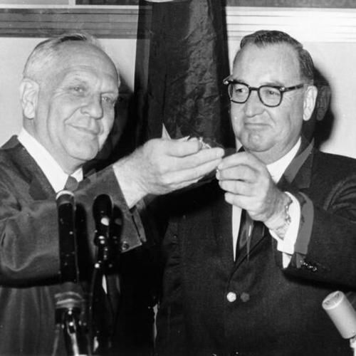 [Retiring Governor Goodwin Knight hands over his office keys to Edmund Brown]