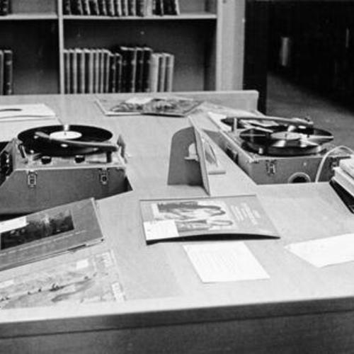 [Patrons listening to records in the Music Department at the Main Library]