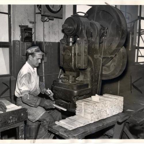 [Dan McLoughlin working with silver ingots at the U. S. Mint in San Francisco]