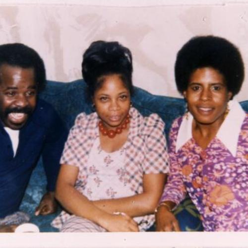 [Clarence with Sandra and Barbara at a family Christmas Party in 1973]