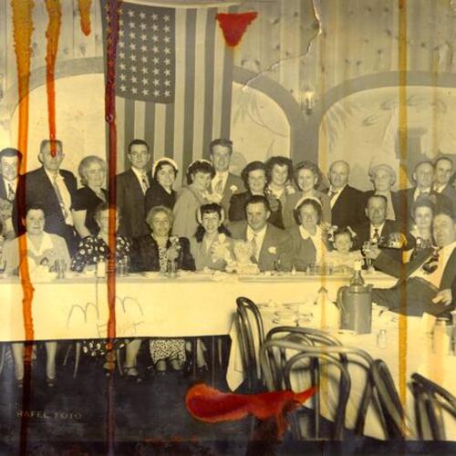 [Unidentified group dining at the New Tivoli restaurant]