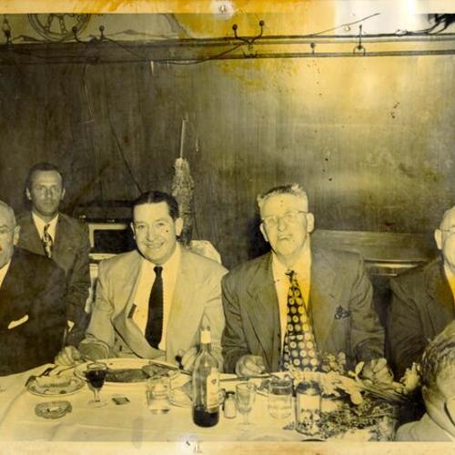 [Group of men in a restaurant in North Beach]