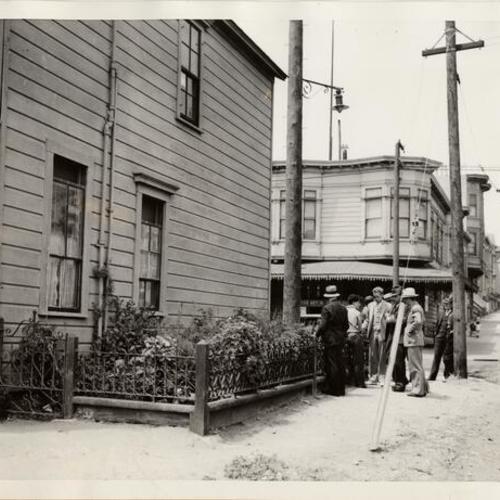 [Agents inspecting marijuana plants in front of Rinaldo Gotti's home in the Mission district]
